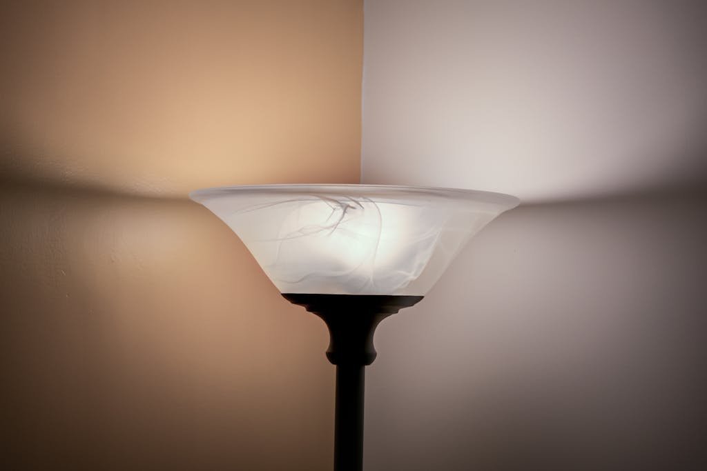 A glowing floor lamp in a minimalist corner creating a warm ambiance.